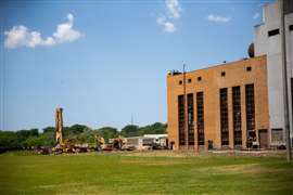 Bierlein excavators outside James DeYoun Power Plant