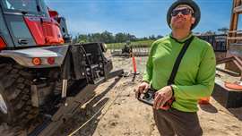 MRT telehandler operator using remote control