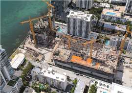 Five Morrow cranes by the ocean working on the Aria Reserve Project in Miami, Florida, USA