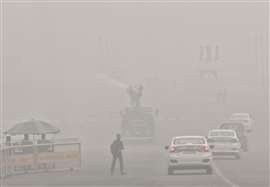 An anti-smog gun on a multi-purpose vehicle sprays water droplets to curb air pollution as Delhi's air quality remains in the 'severe' category, at Raisina Hills in New Delhi on Monday.