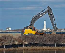 Photo of a Volvo excavator working on Little Brewster Island in Massachusetts Bay, USA, in early December. (Photo: USA Today Network, Reuters Connect)