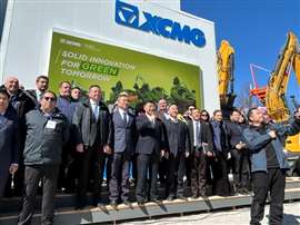 Yang Dongsheng, CEO and chairman of XCMG, gives a thumbs-up after a press event photo-op