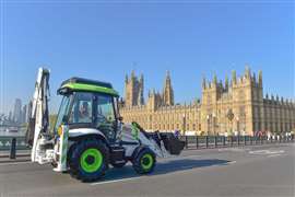 JCB drove a hydrogen-fuelled backhoe loader past the Palace of Westminster to celebrate a change in legislation that allows hydrogen-fuelled construction and agricultural machinery to use UK roads